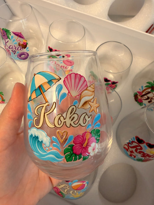 Personalized 15 oz stemless wine glass with colorful custom name and tropical design