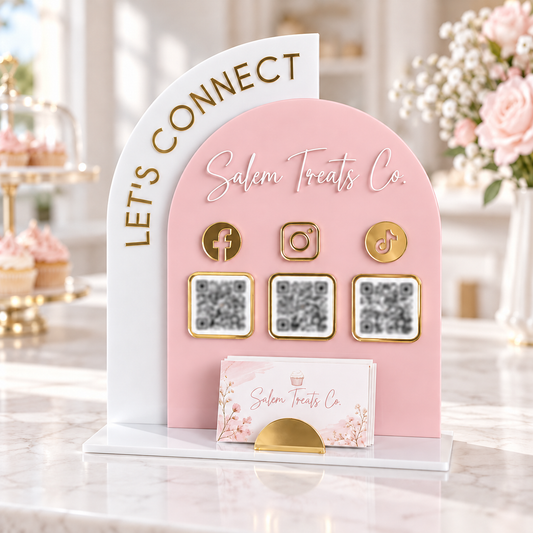 Pink and white Salem Treats Co. Let’s Connect acrylic QR sign mockup with gold accents, business cards and deliberately blurred QR codes.