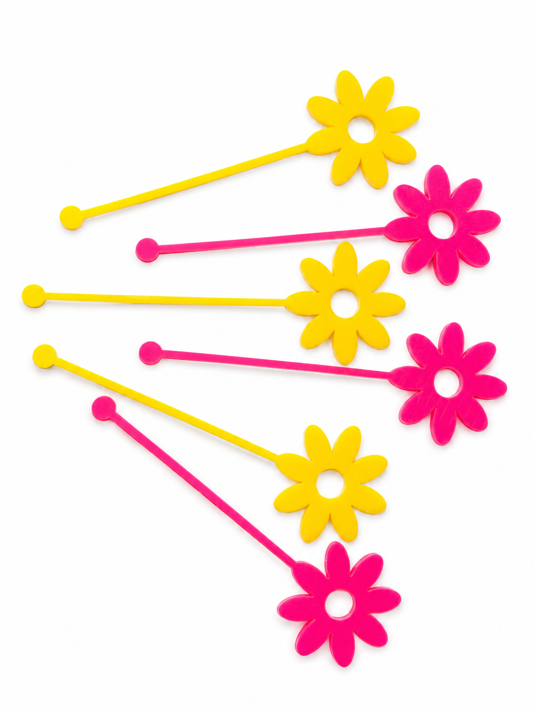 Pink and yellow flower shaped drink stirrers
