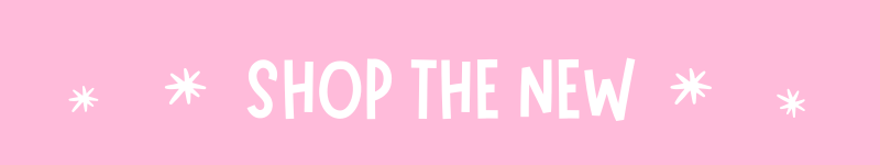 A pink banner with white text reading 'SHOP THE NEW' and small white starburst icons on both sides.