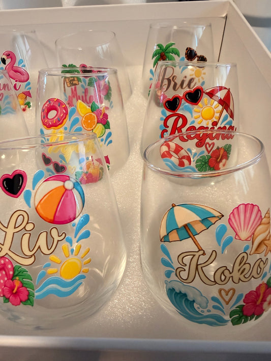 Personalized 15 oz stemless wine glass with colorful custom name and tropical design