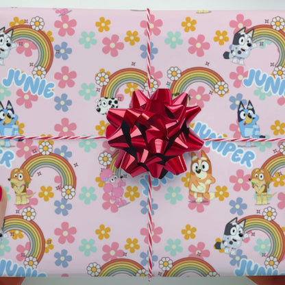 Personalized printed gift wrap with colorful design and red bow