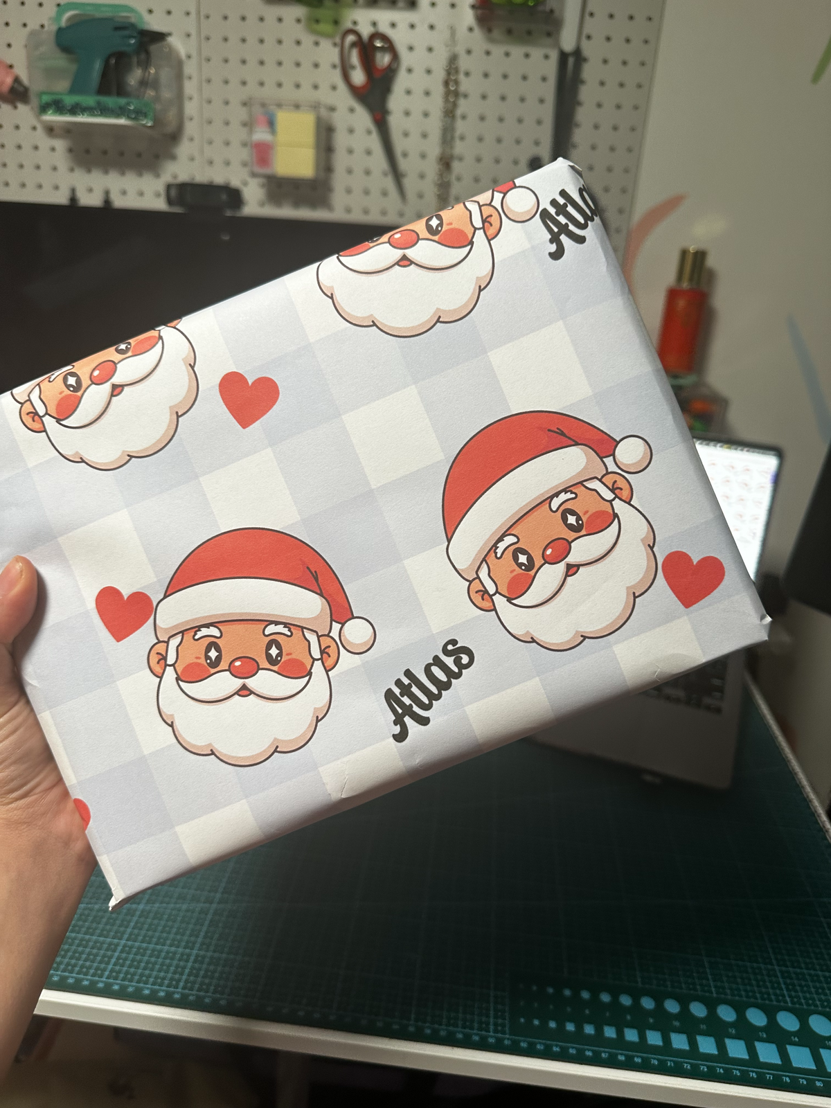 Custom Santa gift wrapping paper on a wrapped present