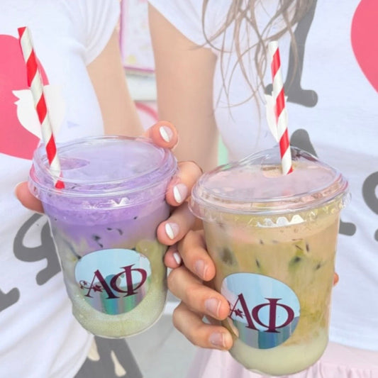 Custom round holographic logo stickers on two iced drink cups