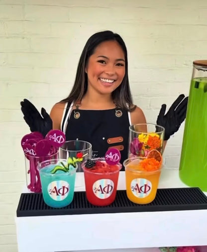 Custom holographic logo stickers displayed on colorful party drink cups