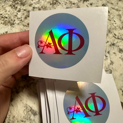 Close-up of a custom circular holographic sticker with a printed design