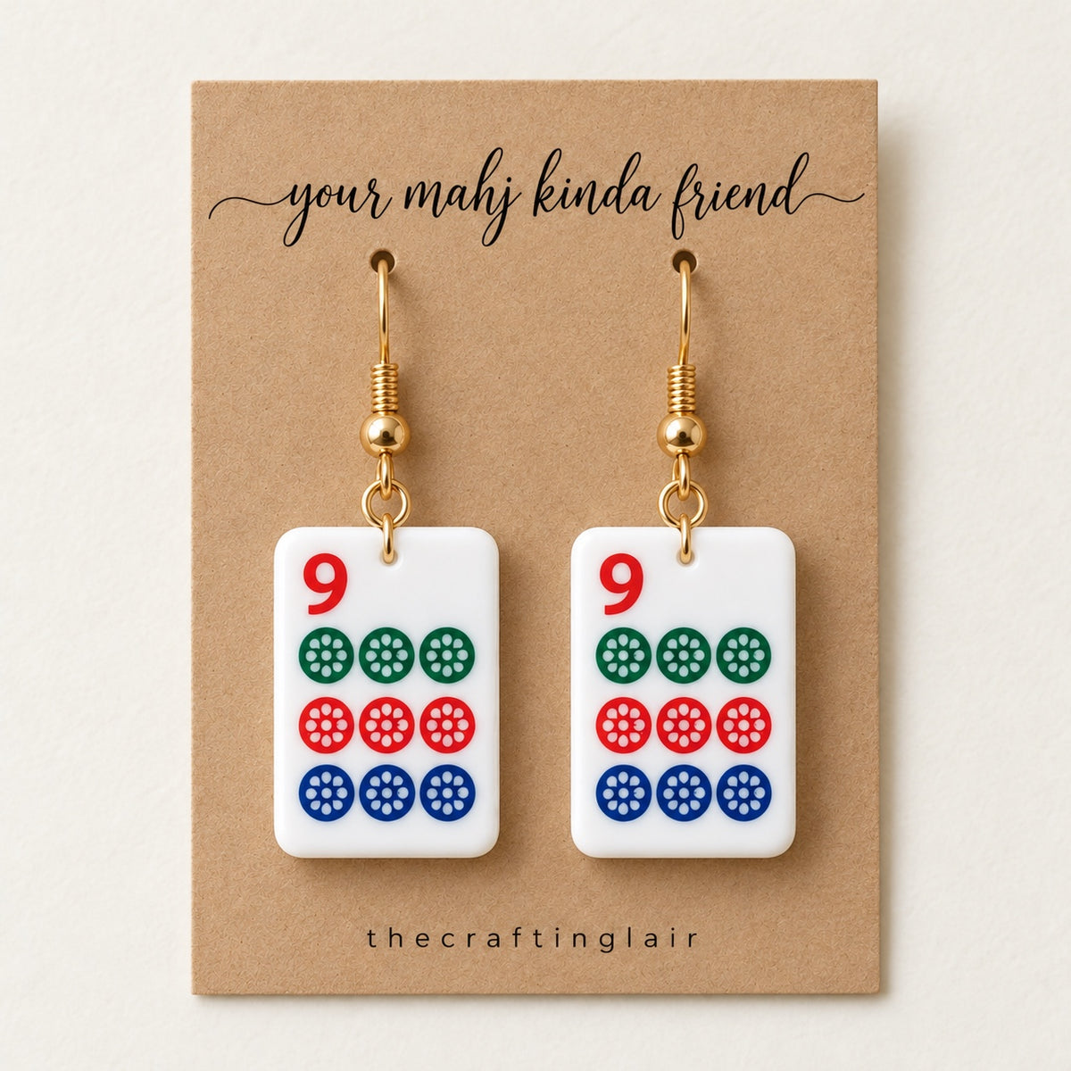 Nine-dot white acrylic mahjong earrings on a kraft card reading your mahj kinda friend by The Crafting Lair.