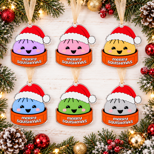 Six Merry Squishmas acrylic ornaments with red Santa hats, one centered top hanging tab and beige ribbons.