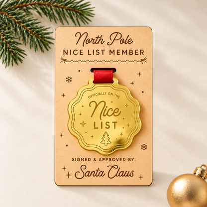 Officially on the Nice List wavy scalloped gold mirror award with Christmas tree engraving, red ribbon, and engraved plywood presentation card.