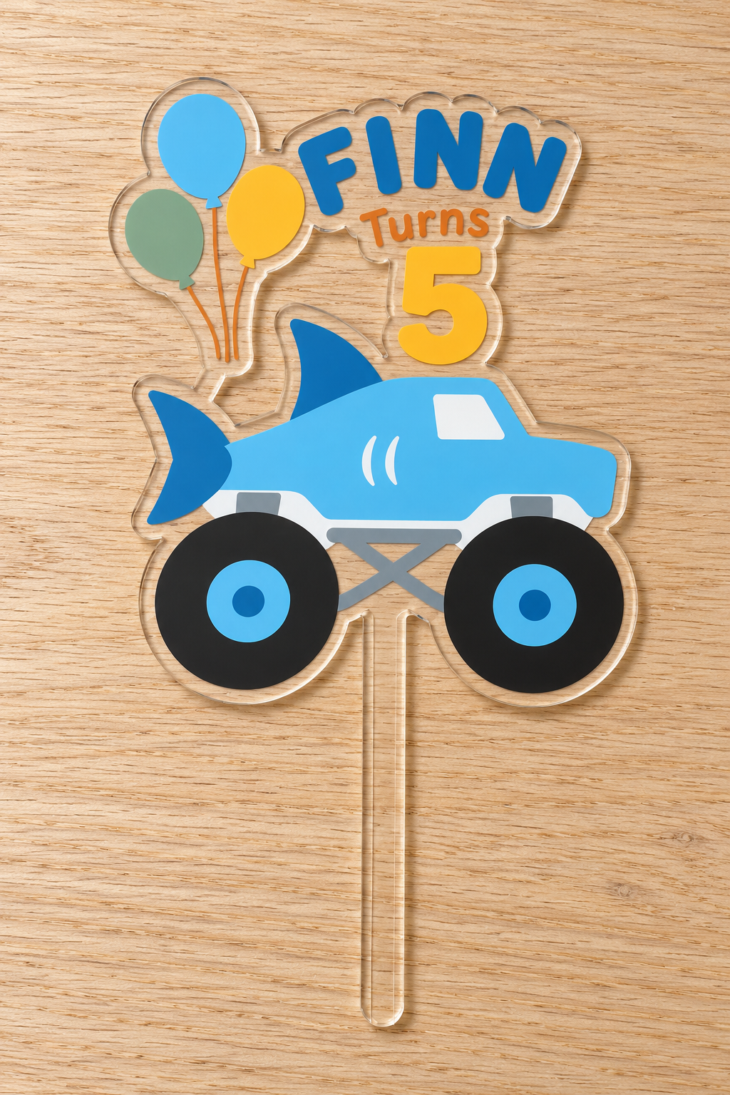 Personalized blue shark monster truck birthday cake topper with custom name and age on clear acrylic