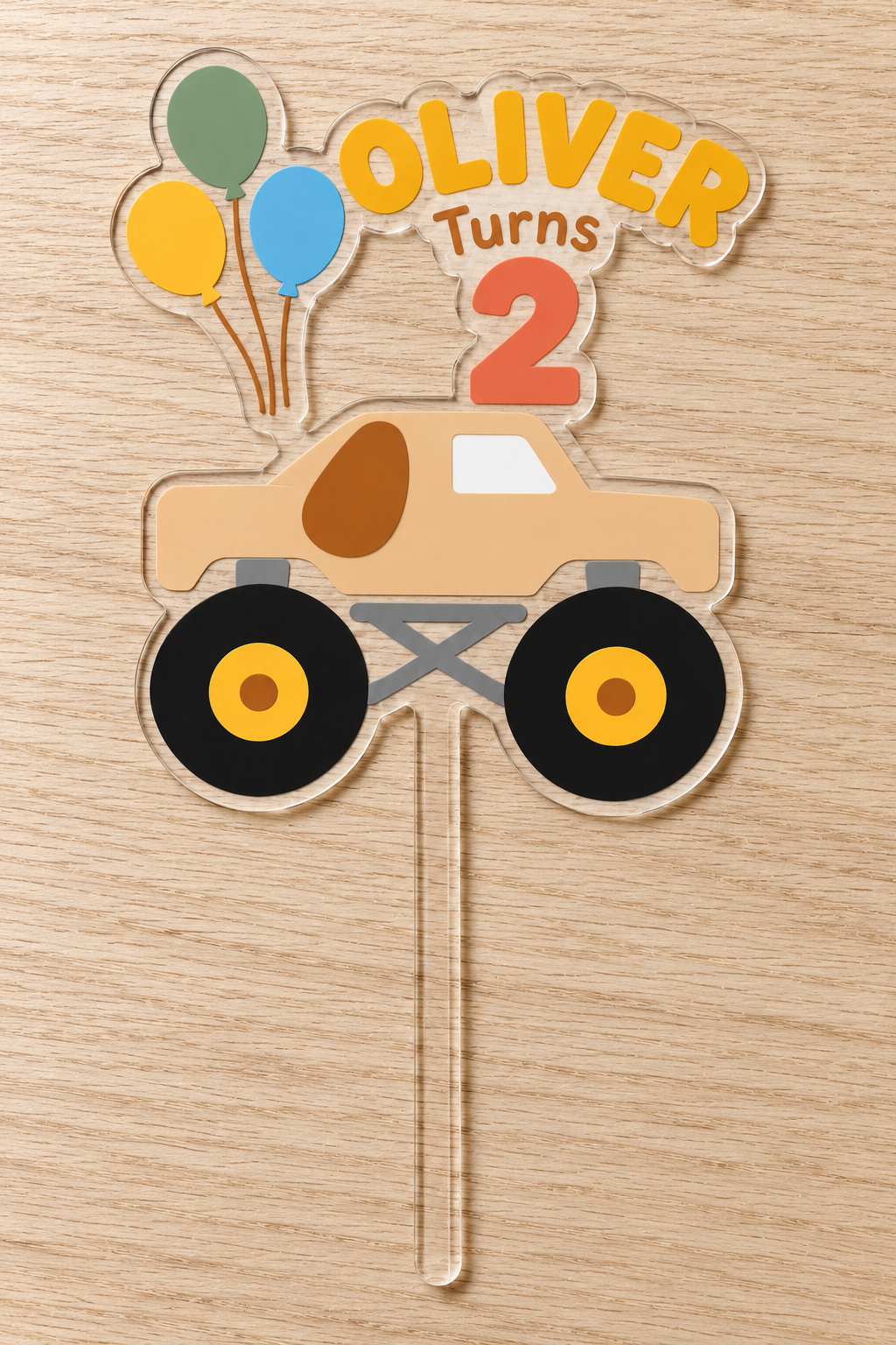 Personalized tan puppy monster truck birthday cake topper with custom name and age on clear acrylic