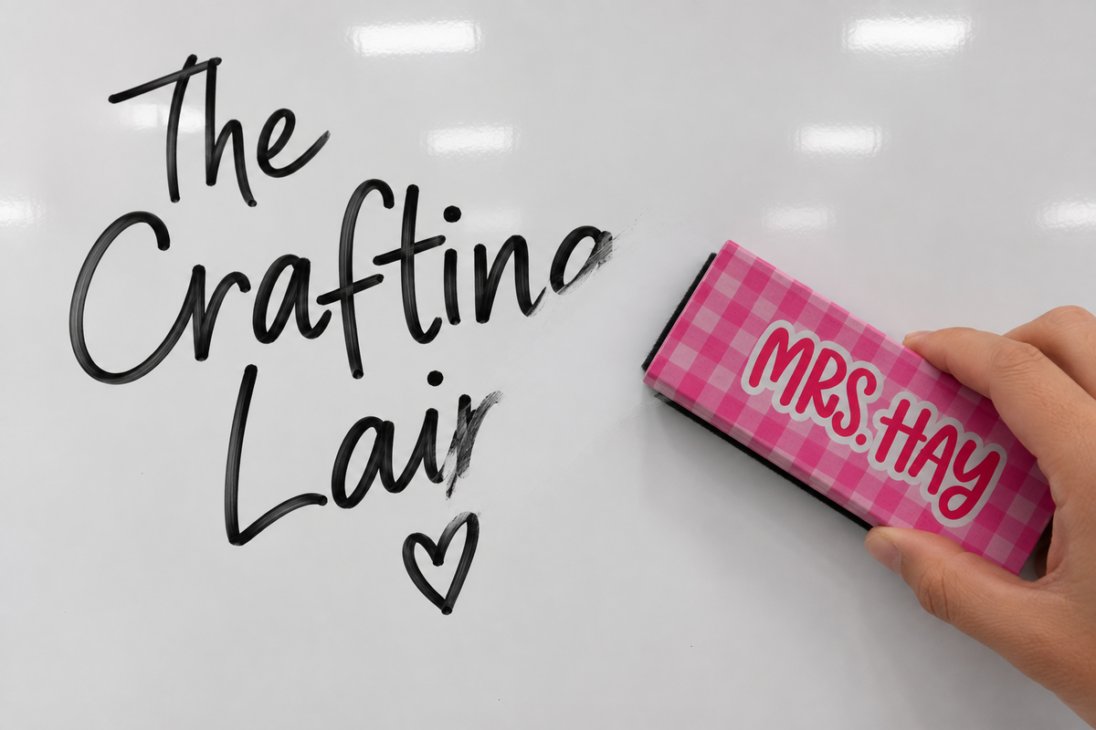Personalized teacher eraser wiping writing from a dry erase board