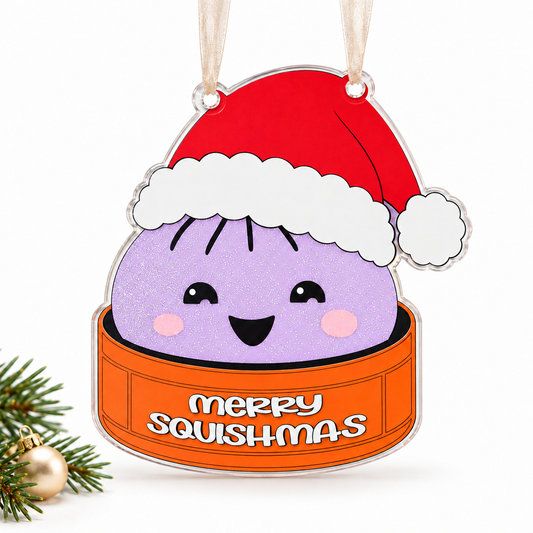 Light purple glitter merry squishmas UV printed acrylic Christmas ornament on a white background, with sheer beige ribbon.