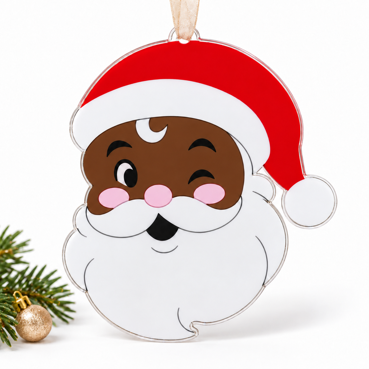 santa UV printed acrylic Christmas ornament in Tone 2 on a studio background, with sheer beige ribbon.